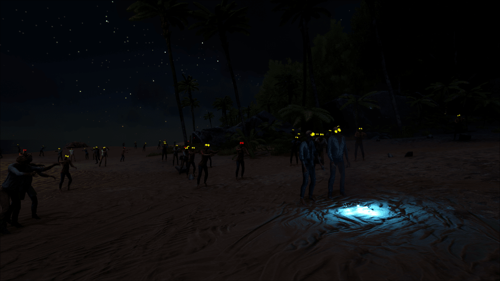 A zombie horde roam the beach at night